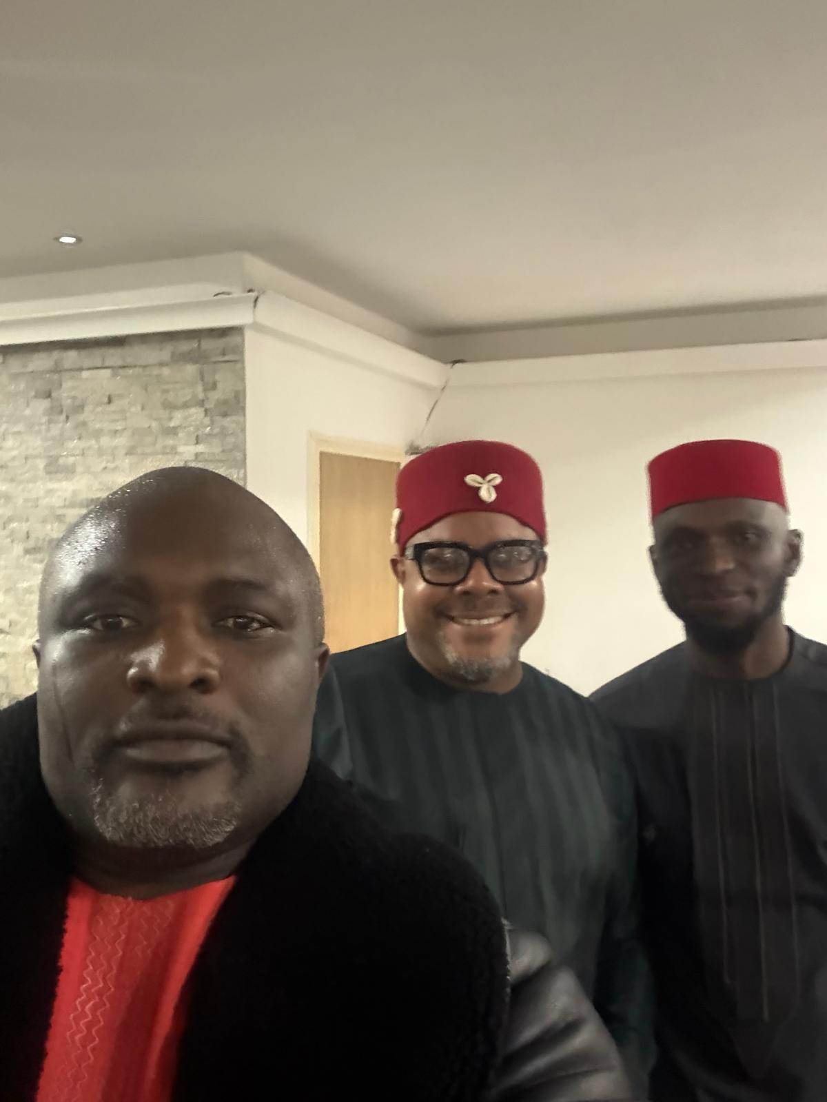 Three members in Igbo red caps at the AUF celebration