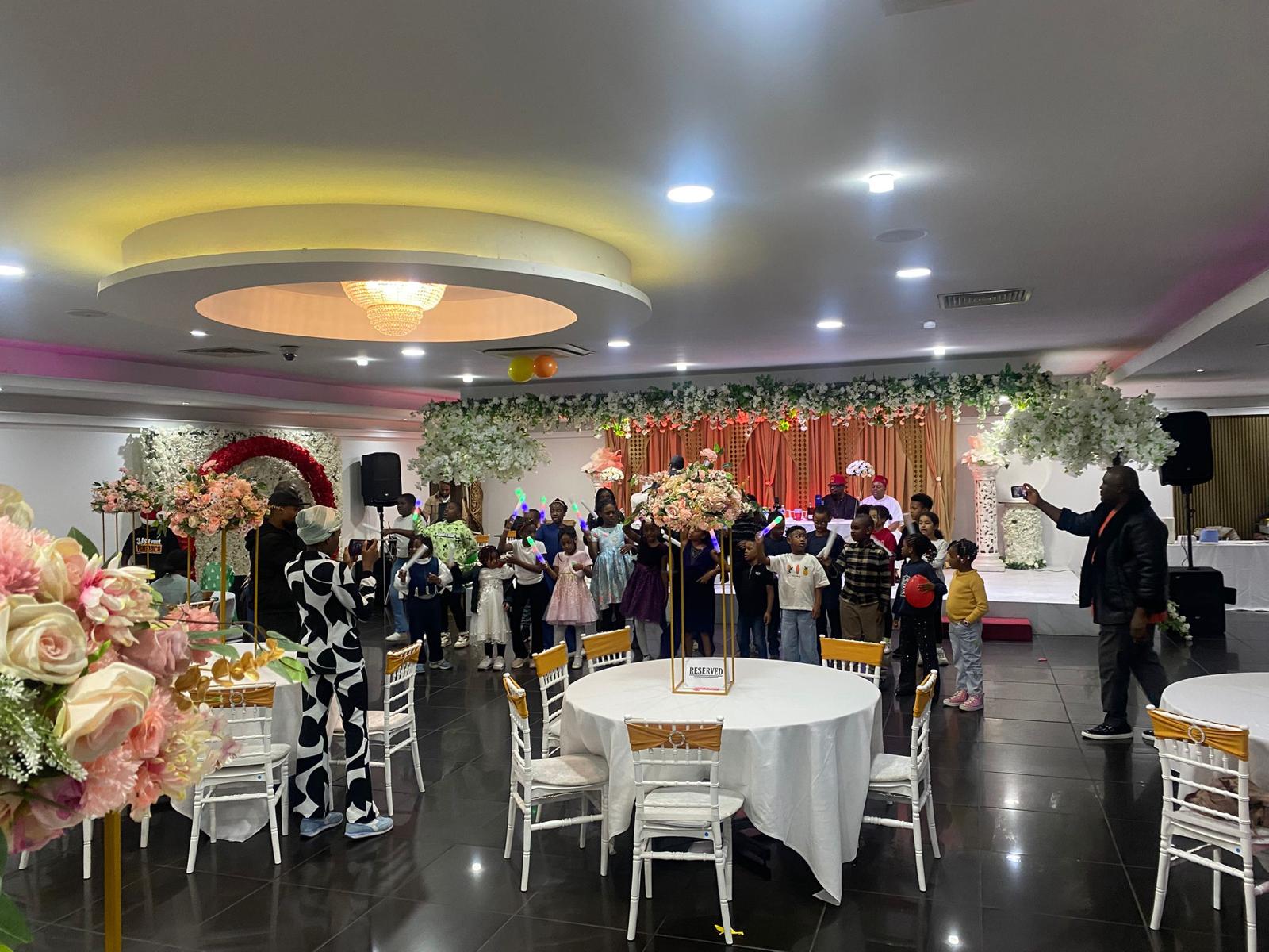 Children gathered on the dance floor at an AUF celebration