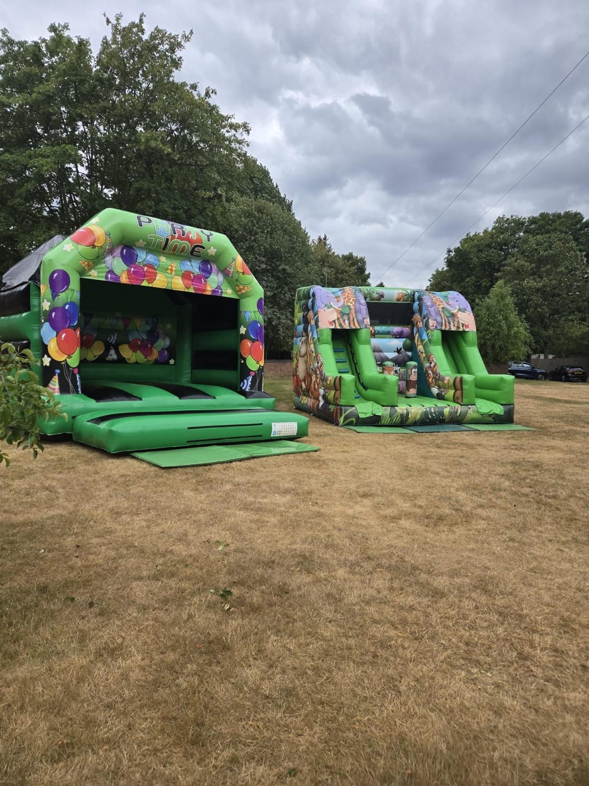 Bouncy castle and inflatable slide set up for children at the AUF family fun day