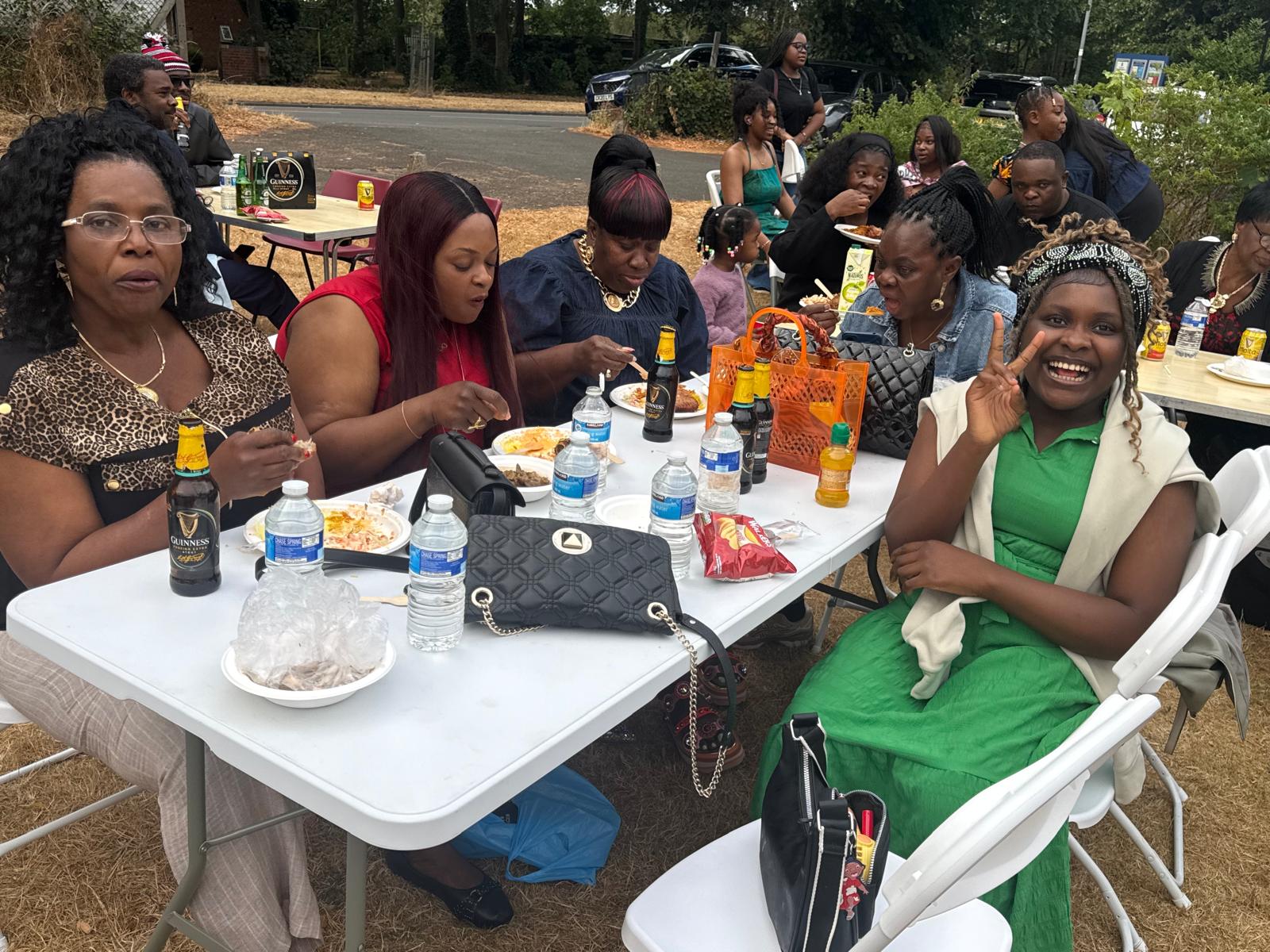 Women of the community sharing a meal at the AUF picnic