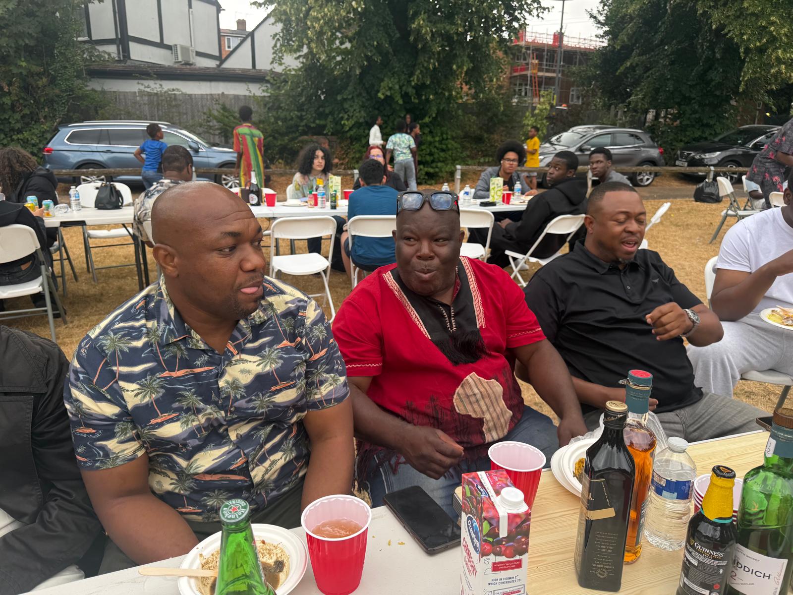 Members chatting over food at the AUF community gathering