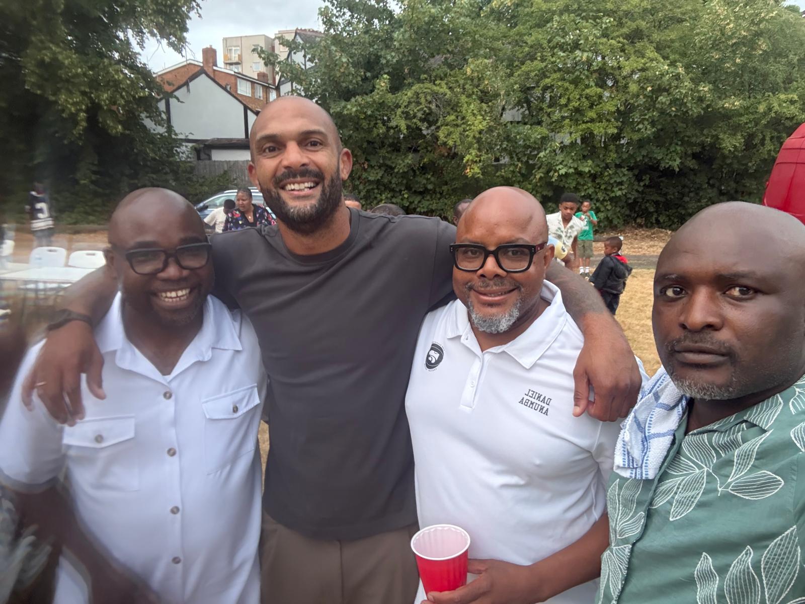AUF members smiling together at the summer community picnic